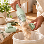 Emptying the GroomPro fur cup into a bin in one click